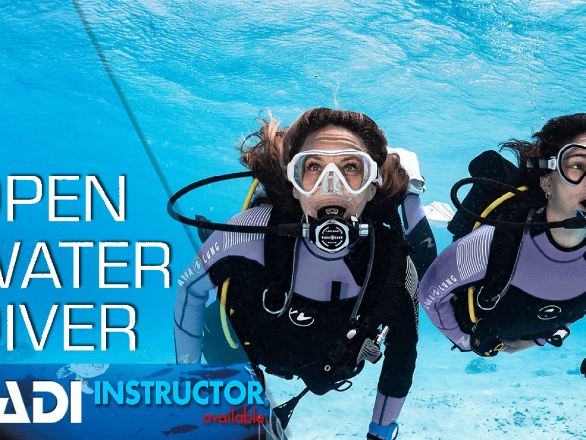 Student diver participating in an PADI open water scuba diving course, receiving instruction and guidance from a certified diving instructor, exploring the underwater world with proper scuba equipment in clear blue waters